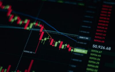 black screen showing green and red line graphs of stock market falling